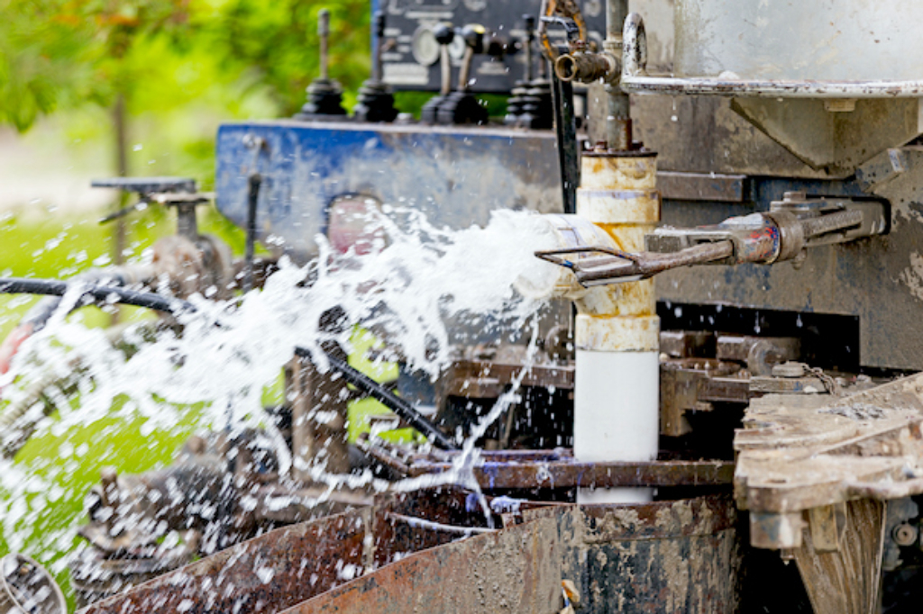 Image depicting a water well drilling rig.